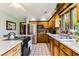 Well-equipped kitchen featuring stainless steel appliances, ample counter space, and modern tile flooring at 33 Brassie Dr., Carolina Shores, NC 28467
