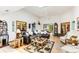 Spacious living room featuring a skylight, hardwood floors, comfortable seating, and a view into other rooms at 33 Brassie Dr., Carolina Shores, NC 28467