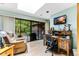 Comfortable office space featuring a skylight, desk, office chair, and sliding glass doors to an outdoor area at 33 Brassie Dr., Carolina Shores, NC 28467