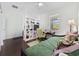 Bright room features a desk, a bed, and a decorative shelf, perfect for relaxing and working at 3381 Pampas Dr., Myrtle Beach, SC 29577