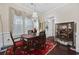 Elegant dining room features a chandelier, large windows, and dark wood flooring at 3381 Pampas Dr., Myrtle Beach, SC 29577