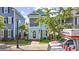 Beautiful two-story house featuring a screened porch, front lawn and mature trees at 3381 Pampas Dr., Myrtle Beach, SC 29577