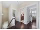 Hallway leading to a bathroom and a bedroom featuring hardwood floors and neutral wall colors at 3381 Pampas Dr., Myrtle Beach, SC 29577