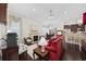 Open-concept living space featuring hardwood floors, a fireplace, and a glimpse of the kitchen at 3381 Pampas Dr., Myrtle Beach, SC 29577