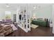 Open living area with comfortable seating, TV, and shelves creating a relaxing atmosphere at 3381 Pampas Dr., Myrtle Beach, SC 29577