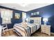 Cozy bedroom with beach-themed decor, comfortable bed, and ample natural light at 342 Pinehurst Ln. # 12J, Pawleys Island, SC 29585