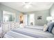 Comfortable bedroom with striped bedding, white furniture, and access to other rooms at 342 Pinehurst Ln. # 12J, Pawleys Island, SC 29585