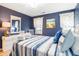 Inviting bedroom with coastal decor, comfortable bed, and plenty of natural light at 342 Pinehurst Ln. # 12J, Pawleys Island, SC 29585