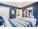 Comfortable bedroom with coastal-themed decor, soft lighting, and closet at 342 Pinehurst Ln. # 12J, Pawleys Island, SC 29585