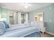 Serene bedroom with large windows, access to balcony and view of tree tops at 342 Pinehurst Ln. # 12J, Pawleys Island, SC 29585