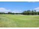 Picturesque golf course view with a tranquil lake surrounded by lush greenery at 342 Pinehurst Ln. # 12J, Pawleys Island, SC 29585