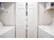 Convenient laundry area with washer, dryer, shelving, and ample storage space at 342 Pinehurst Ln. # 12J, Pawleys Island, SC 29585
