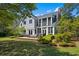 Back exterior of the home with screened in porch and outdoor seating area at 352 Old Carriage Loop, Georgetown, SC 29440