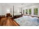 Spacious bedroom with hardwood floors and access to a private balcony with outdoor seating at 352 Old Carriage Loop, Georgetown, SC 29440