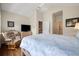 Cozy bedroom features a rocking chair and a comfortable bed with a blue floral comforter at 352 Old Carriage Loop, Georgetown, SC 29440