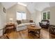 Cozy living room featuring hardwood floors, vaulted ceilings, and comfortable seating at 352 Old Carriage Loop, Georgetown, SC 29440