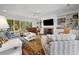 Spacious living room with fireplace and large windows at 352 Old Carriage Loop, Georgetown, SC 29440