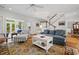 Open-concept living area with staircase and natural light at 352 Old Carriage Loop, Georgetown, SC 29440