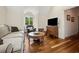Comfortable living room featuring hardwood floors, vaulted ceilings, and natural light at 352 Old Carriage Loop, Georgetown, SC 29440