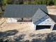 New construction home with grey shingled roof and attached two-car garage at 357 Log Cabin Rd., Loris, SC 29569