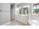 The bathroom features a double sink vanity, tile flooring, and a soaking tub at 357 Log Cabin Rd., Loris, SC 29569