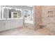 The bathroom features a double sink vanity, tile flooring, a soaking tub, and a tiled shower at 357 Log Cabin Rd., Loris, SC 29569