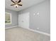 This bedroom features carpet flooring, a ceiling fan, a window, and a closet at 357 Log Cabin Rd., Loris, SC 29569