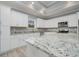 Modern kitchen featuring white cabinets, granite countertops, stainless steel appliances, and a large island at 357 Log Cabin Rd., Loris, SC 29569