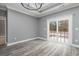 Bright room with sliding glass door leading to the outside with neutral colored walls and floor at 357 Log Cabin Rd., Loris, SC 29569