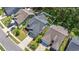 Aerial view of a gray house with a manicured lawn, a fenced in yard, and long driveway at 3725 Park Pointe Ave., Little River, SC 29566