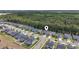 An aerial view shows a home's location within a community with many mature trees at 3725 Park Pointe Ave., Little River, SC 29566