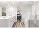 Bright bathroom featuring double vanity, soaking tub with glass shower and bedroom view at 3725 Park Pointe Ave., Little River, SC 29566