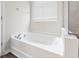 Bright white soaking tub with chrome fixtures next to a glass enclosed shower at 3725 Park Pointe Ave., Little River, SC 29566