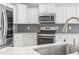 Modern kitchen featuring stainless steel appliances and stylish backsplash at 3725 Park Pointe Ave., Little River, SC 29566