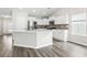 Bright kitchen featuring an island, stainless steel appliances, and white cabinetry at 3725 Park Pointe Ave., Little River, SC 29566