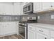 Kitchen featuring stainless steel range and appliances with white cabinets at 3725 Park Pointe Ave., Little River, SC 29566