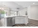 Kitchen featuring white cabinets, stainless steel appliances, and wood-look flooring at 3725 Park Pointe Ave., Little River, SC 29566