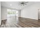 Spacious living room featuring lots of natural light and wood-look flooring at 3725 Park Pointe Ave., Little River, SC 29566