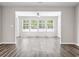 Bright sunroom with large windows offering picturesque outdoor views at 3725 Park Pointe Ave., Little River, SC 29566