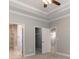 Primary bedroom featuring a view to the walk-in closet, bathroom, and bedroom hallway at 375 Log Cabin Rd., Loris, SC 29569