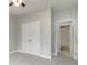 Bedroom with gray walls, plush carpet, and access to a hallway and closet at 375 Log Cabin Rd., Loris, SC 29569
