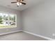 Bedroom with neutral walls, plush carpet, and a window view of a neighborhood at 375 Log Cabin Rd., Loris, SC 29569