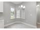Inviting breakfast nook with bright windows and stylish chandelier provides a cozy dining space at 375 Log Cabin Rd., Loris, SC 29569