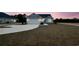 Lovely home at twilight features light blue siding, a two-car garage, and a spacious front lawn at 375 Log Cabin Rd., Loris, SC 29569