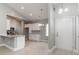 Bright, open-concept interior showcases white cabinets, stainless appliances, and modern lighting at 375 Log Cabin Rd., Loris, SC 29569