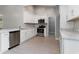 Modern kitchen with stainless appliances, white cabinets, and marble countertops at 375 Log Cabin Rd., Loris, SC 29569
