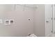 Bright laundry area featuring utility connections, wire shelving, and a white door for easy access at 375 Log Cabin Rd., Loris, SC 29569