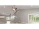 Open-concept living space features vaulted ceilings, modern fan, and a sliding door to the patio at 375 Log Cabin Rd., Loris, SC 29569