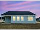 This home boasts backyard with a covered porch and large windows at 375 Log Cabin Rd., Loris, SC 29569