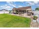 Expansive backyard with a brick patio, pergola, outdoor seating, and lush green lawn at 3757 Kingsley Dr., Myrtle Beach, SC 29588